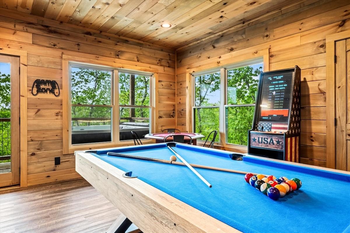 Pool table and an arcade. Plenty of entertainment pieces in Jester Cabin